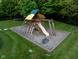 Backyard featuring a wooden playset with a slide, swings, and a small trampoline at 11101 Hawthorn Rdg, Fishers, IN 46037