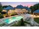 Expansive home featuring a stunning pool, slide, and luxurious poolside lounging at 11101 Hawthorn Rdg, Fishers, IN 46037