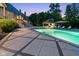 Stunning pool area featuring a covered outdoor seating area, perfect for entertaining at 11101 Hawthorn Rdg, Fishers, IN 46037