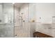 Luxurious walk-in shower featuring marble walls and a built-in bench at 11101 Hawthorn Rdg, Fishers, IN 46037