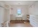 Spacious walk-in closet with custom shelving, a center desk, and natural light at 11101 Hawthorn Rdg, Fishers, IN 46037