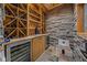 Beautifully designed wine cellar featuring wood racks, brick accent wall and a cooler at 11101 Hawthorn Rdg, Fishers, IN 46037