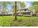 A view of the house and backyard from the left side of the property at 1113 Delray Dr, Indianapolis, IN 46241