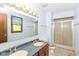 Bathroom featuring a double sink vanity and glass door shower at 1113 Delray Dr, Indianapolis, IN 46241