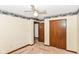 Bedroom showcasing closet space and a doorway to another room at 1113 Delray Dr, Indianapolis, IN 46241