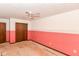 A bedroom with ceiling fan and trim, and outdated two-tone paint at 1113 Delray Dr, Indianapolis, IN 46241