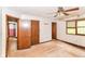 Bedroom with multiple closets and doorways, providing ample storage at 1113 Delray Dr, Indianapolis, IN 46241