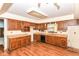 A kitchen area features wood cabinets and linoleum flooring at 1113 Delray Dr, Indianapolis, IN 46241