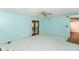 Spacious living room features sliding door and ceiling fan at 1113 Delray Dr, Indianapolis, IN 46241