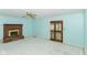 Living room features brick fireplace and a sliding glass door at 1113 Delray Dr, Indianapolis, IN 46241