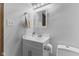 Bright bathroom featuring white vanity, modern fixtures, and a decorative mirror at 1121 Barcelona Dr, Greenwood, IN 46143