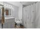Bathroom featuring a vanity, framed mirror, toilet, and shower with a tropical themed shower curtain at 1121 Barcelona Dr, Greenwood, IN 46143
