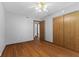 This bedroom features hardwood floors and neutral paint, and a large closet at 1121 Barcelona Dr, Greenwood, IN 46143