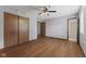 Bedroom with hardwood floors, neutral paint, closet, and access to bathroom at 1121 Barcelona Dr, Greenwood, IN 46143
