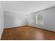 A bright bedroom with laminate floors and a large window at 1121 Barcelona Dr, Greenwood, IN 46143