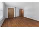 A bright bedroom with laminate floors and a large window at 1121 Barcelona Dr, Greenwood, IN 46143
