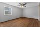 Large bedroom with hardwood floors, ceiling fan, and ample natural light at 1121 Barcelona Dr, Greenwood, IN 46143