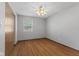 Spacious bedroom featuring hardwood floors, ceiling fan, and natural light at 1121 Barcelona Dr, Greenwood, IN 46143