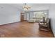 Open living room with hardwood floors, ceiling fan and neutral paint at 1121 Barcelona Dr, Greenwood, IN 46143