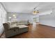 Spacious living room with hardwood floors, neutral walls and a large comfy sectional at 1121 Barcelona Dr, Greenwood, IN 46143