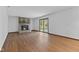 Open living space with brick fireplace and sliding doors to the backyard at 1121 Barcelona Dr, Greenwood, IN 46143