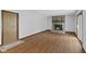 Spacious living room features a brick fireplace, sliding glass door, and vinyl floors at 1121 Barcelona Dr, Greenwood, IN 46143
