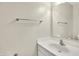 Bright bathroom featuring a white sink, vanity, and a large mirror at 11849 Traymoore Dr, Fishers, IN 46038