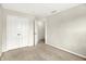 Empty bedroom featuring neutral paint, carpet, double door closet, and ample natural light at 11849 Traymoore Dr, Fishers, IN 46038