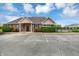 Exterior of the clubhouse showcasing a well-maintained facade and ample parking, offering a welcoming community gathering space at 11849 Traymoore Dr, Fishers, IN 46038