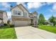 Two story home with a brick and vinyl exterior, two car garage, and a well manicured lawn at 11849 Traymoore Dr, Fishers, IN 46038