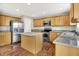 Modern kitchen featuring stainless appliances, a large island, and stylish countertops at 11849 Traymoore Dr, Fishers, IN 46038