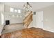 Bright living room featuring fireplace, staircase, and open floor plan with ample sunlight at 11849 Traymoore Dr, Fishers, IN 46038