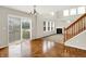 Bright living room features a fireplace, high ceilings, large windows and a sliding door at 11849 Traymoore Dr, Fishers, IN 46038