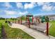 Playground view with colorful play structures offering a fun and safe environment for children in a Gathering-friendly community at 11849 Traymoore Dr, Fishers, IN 46038
