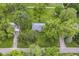 Aerial view of a home with a large lot surrounded by lush trees at 1248 Hathaway Dr, Indianapolis, IN 46229