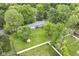 Aerial view of home with large backyard, shed, trees, and surrounding neighborhood at 1248 Hathaway Dr, Indianapolis, IN 46229