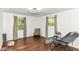 Spacious bedroom featuring hardwood floors, natural light, and a relaxing reading nook at 1248 Hathaway Dr, Indianapolis, IN 46229