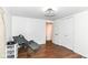Bright bedroom offering neutral walls, hardwood floors, and closet with double doors at 1248 Hathaway Dr, Indianapolis, IN 46229