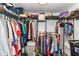 Walk-in closet with metal shelving holding lots of neatly organized clothes, shoes, and accessories at 1248 Hathaway Dr, Indianapolis, IN 46229