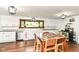 Traditional kitchen with stainless steel dishwasher, white cabinetry, and modern lighting fixtures at 1248 Hathaway Dr, Indianapolis, IN 46229