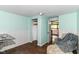 Bright office space with wainscoting, large window, and view to kitchen at 1248 Hathaway Dr, Indianapolis, IN 46229