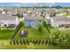 Spacious backyard features lush grass, playground, and fenced-in yard, perfect for outdoor enjoyment at 12672 Amber Star Dr, Noblesville, IN 46060