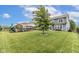 Spacious backyard featuring a lush lawn and a playset, ideal for outdoor activities at 12672 Amber Star Dr, Noblesville, IN 46060