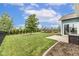 Green backyard featuring mature tree, patio, and playset, creating a Gathering-friendly outdoor oasis at 12672 Amber Star Dr, Noblesville, IN 46060