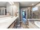 Modern bathroom featuring a walk-in shower and a luxurious soaking tub perfect for relaxation and comfort at 12672 Amber Star Dr, Noblesville, IN 46060