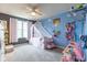 This bedroom features playful decor and a whimsical canopy bed creating a charming and imaginative space at 12672 Amber Star Dr, Noblesville, IN 46060