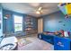 A race car themed bedroom provides a creative and playful atmosphere for the children at 12672 Amber Star Dr, Noblesville, IN 46060