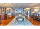 Open concept dining room with wood floors connecting seamlessly to the kitchen and living areas at 12672 Amber Star Dr, Noblesville, IN 46060