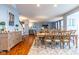 Open concept dining room featuring a large dining table, buffet, and open view to the living room at 12672 Amber Star Dr, Noblesville, IN 46060