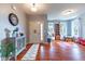 Front entryway with a view into a playroom, featuring hardwood floors and natural light at 12672 Amber Star Dr, Noblesville, IN 46060